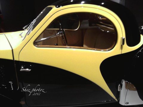 A completely restored 1930s vintage Bugatti, yellow and black